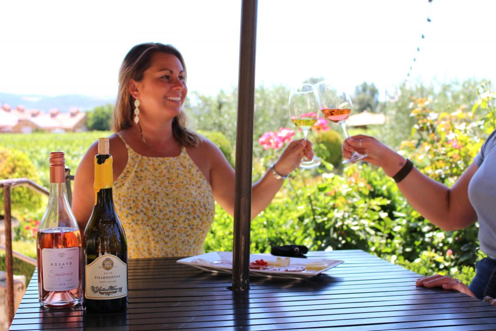 a person holding a glass of wine