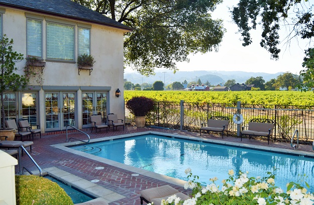 The pool at the Vineyard Country Inn with beautiful vineyard views, located in St. Helena, CA