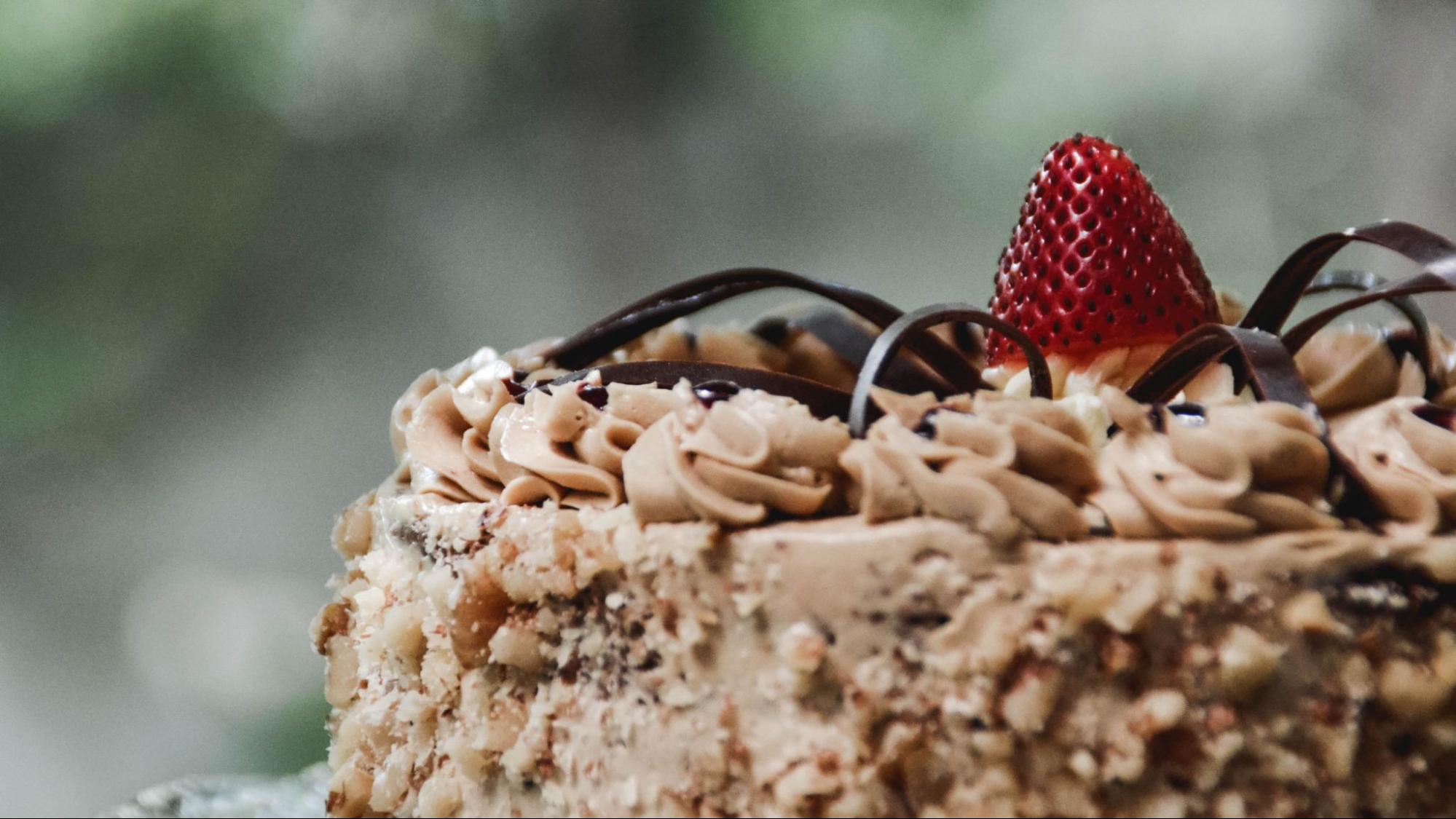 A german chocolate cake with strawberry on top that pairs perfectly with V Sattui’s  Madeira Wine