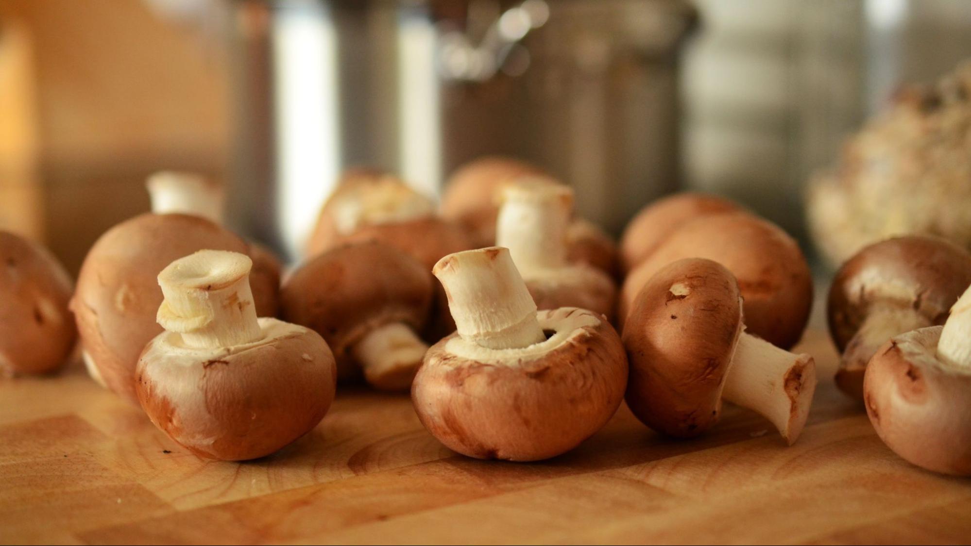 Brown mushrooms on a cutting board - stuffed with Havarti and baked, they are perfect with V. Sattui 2022 Off-Dry Riesling