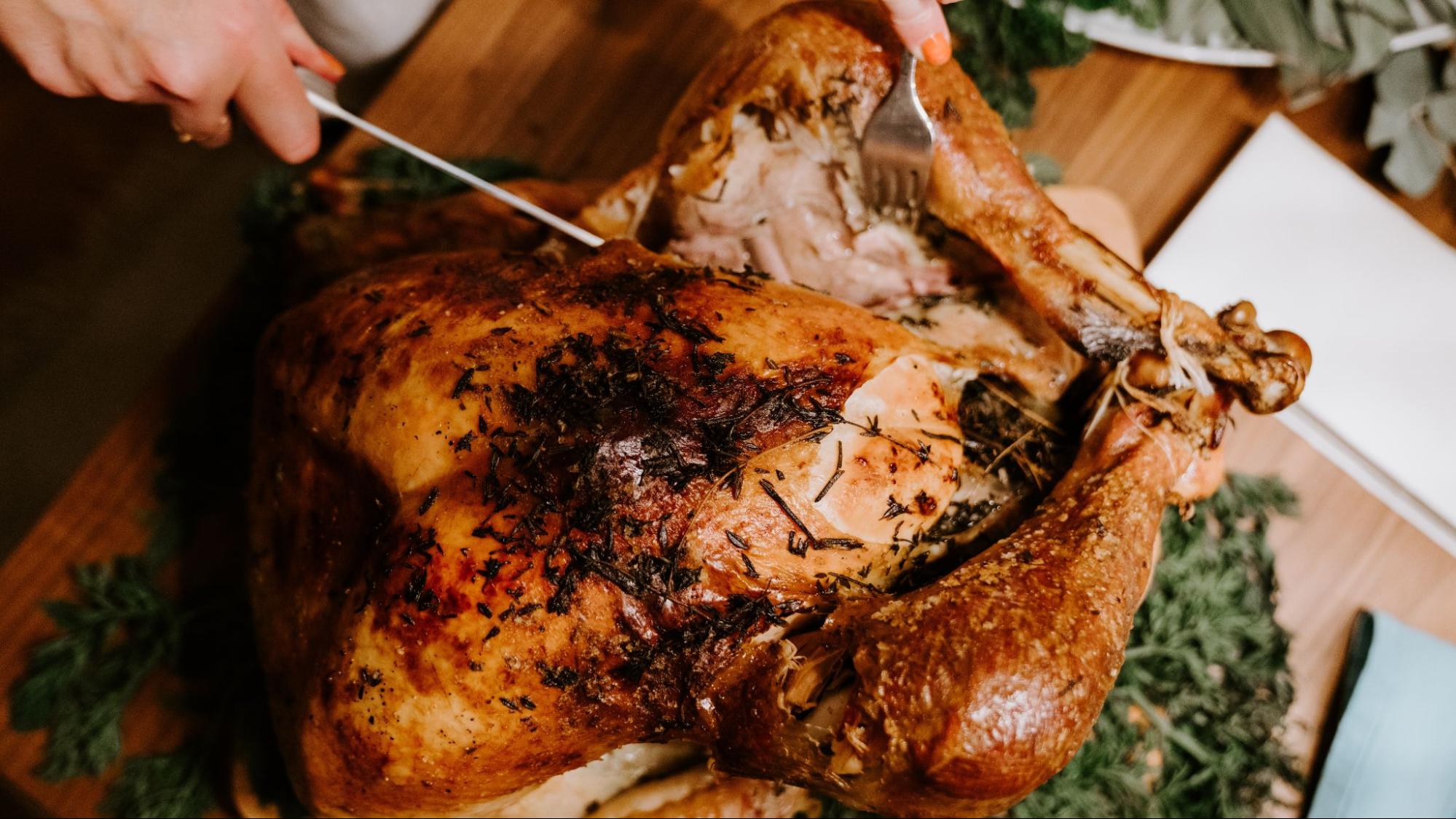 Carving a roast Thanksgiving turkey, a savory pairing with V. Sattui 2020 Ramazzotti Zinfandel.