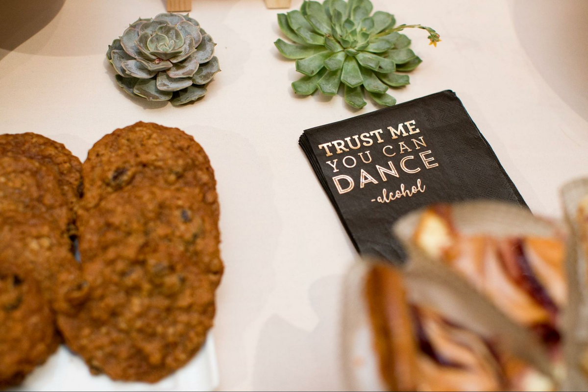 a table topped with cookies and a book