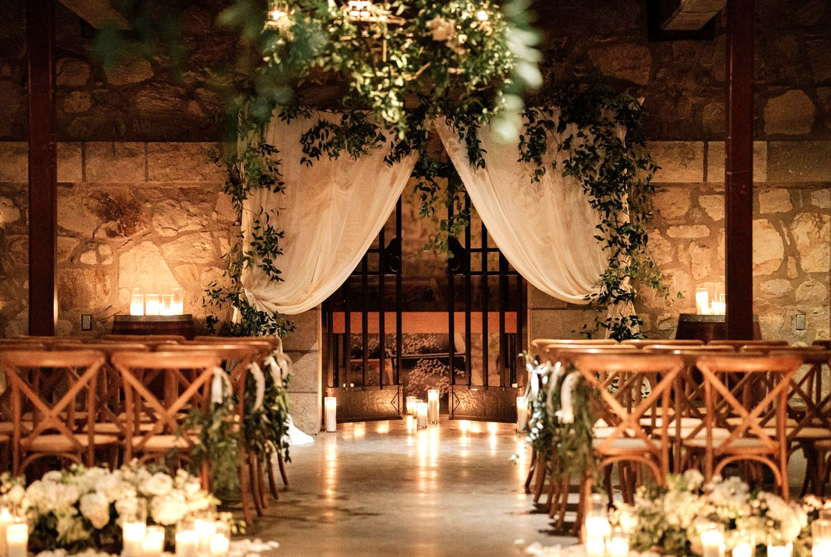 a wedding ceremony with candles and flowers
