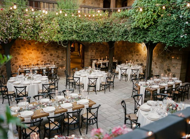 an outdoor dining area with tables and chairs