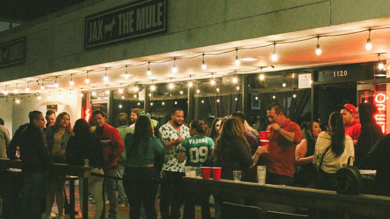 A crowded outdoor patio in front of JAX White Mule Diner in Napa, CA