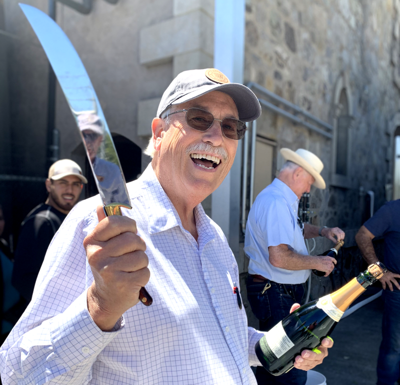 man with a champagne saber, as shown in the V. Sattui wine blog on Napa Valley sparkling wine