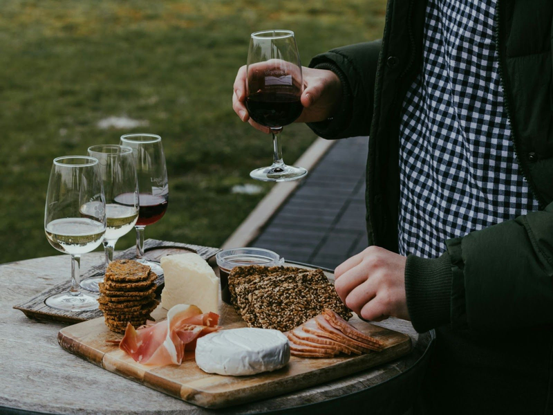 red wine pairing with cookies, meat, cake, cheese in a tray with 4 wine glasses practicing for wine tasting experience, as featured in vsattui